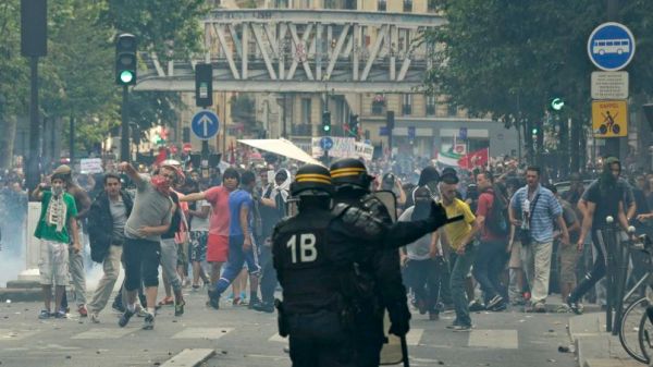 Pro-Palestinian protesters throw projectiles during a demonstration against violence in the Gaza strip in Paris