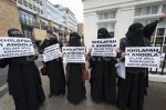 1385742826-muslims-protest-at-angola-embassy-london_3371493